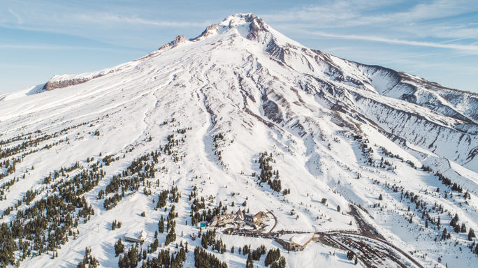An aerial view of Mount Hood with Timblerline Lodge at the bottom