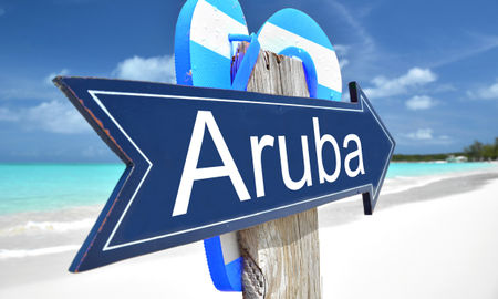 Aruba sign on the beach (Photo via Pincasso / iStock / Getty Images Plus)