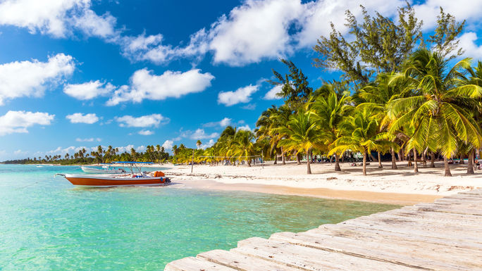 Beautiful caribbean beach on Saona island, Dominican Republic (photo via czekma13 / iStock / Getty Images Plus)