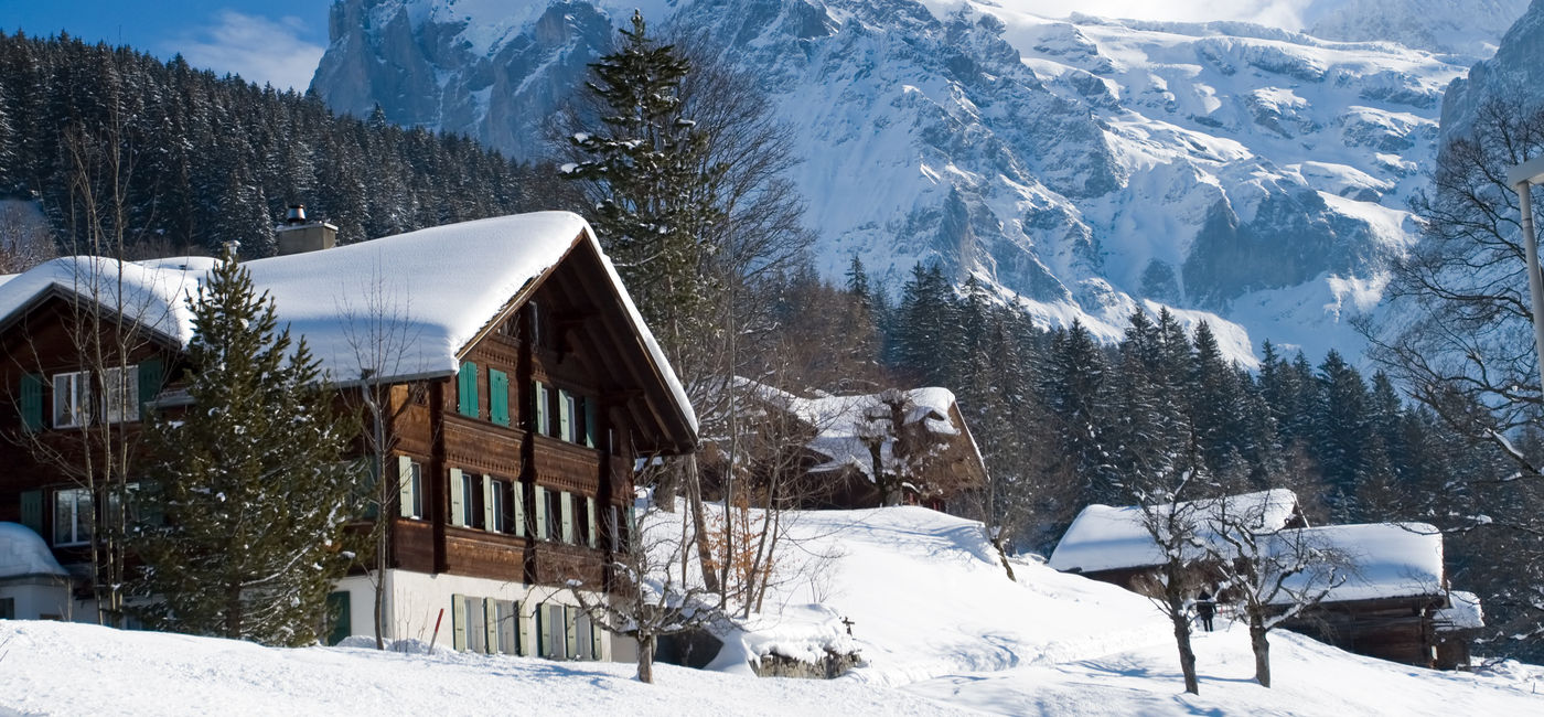 Image: A hotel covered in snow near the Grindelwald area in Interlaken. (photo via  iStock / Getty Images Plus /  Pilin_Petunyia)