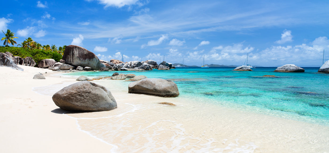 Image: Beautiful tropical beach with white sand, turquoise ocean water and blue sky at Virgin Gorda, British Virgin Islands in Caribbean (Photo via shalamov / iStock / Getty Images Plus)