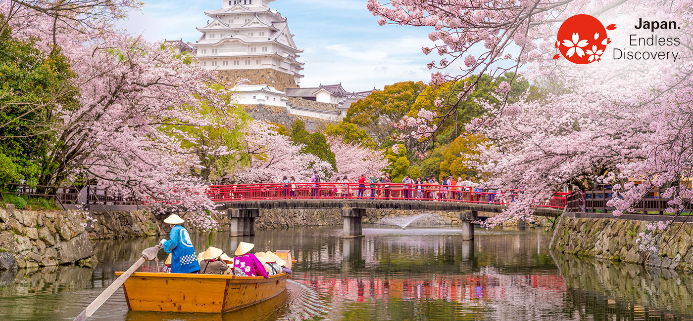 Image: Boat ride on the moat of Himeji Castle with cherry blossoms in Japan. (Photo Credit: Goway Travel/Richie Chan/Adobe Stock)