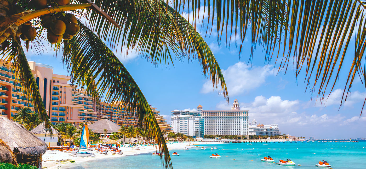 Image: Cancun beach with hotels. (photo viapawel.gaul / iStock / Getty Images Plus)