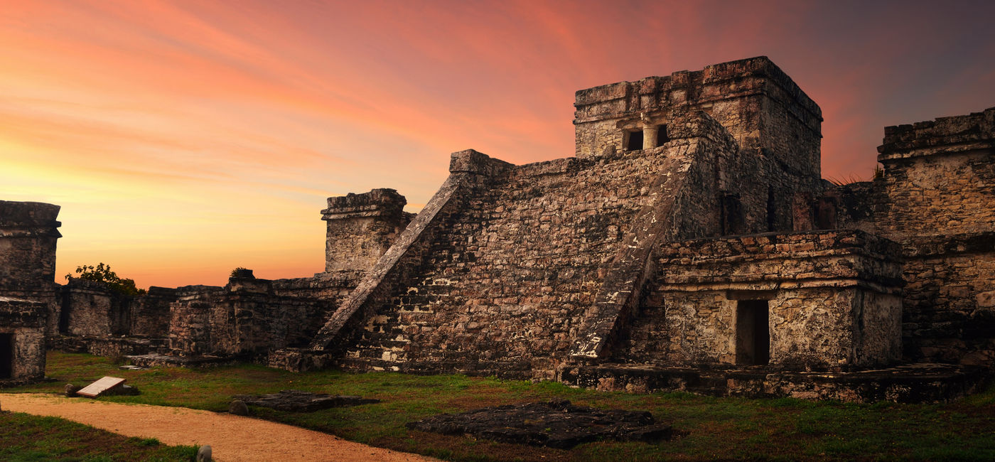 Image: Castillo fortress at sunset in the ancient Mayan city of Tulum, Mexico (photo via Soft_Light / iStock / Getty Images Plus)