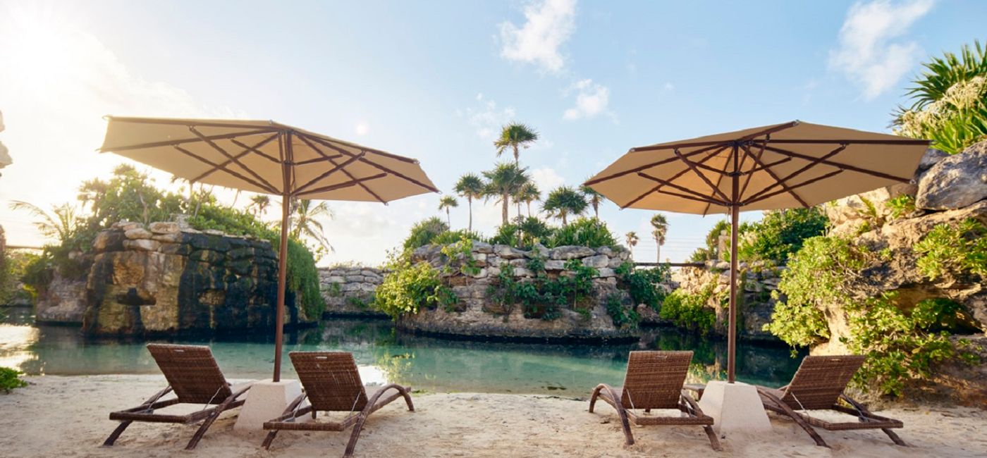 Image: Chairs by the water. (Photo Credit: Hotel Xcaret Mexico)