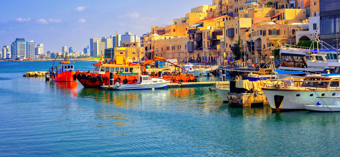 Image: Old town and port of Jaffa and modern skyline of Tel Aviv, Israel. (photo via Xantana / iStock / Getty Images Plus)