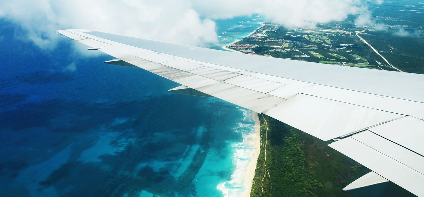 Image: PHOTO: Views from an airplane wing. (photo courtesy Adobe Stock / Gerisima)
