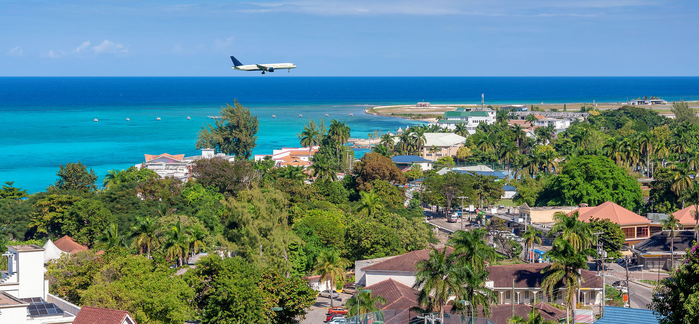Image: Plane landing in Montego Bay, Jamaica. (Photo Credit: lucky-photographer/iStock/Getty Images Plus)