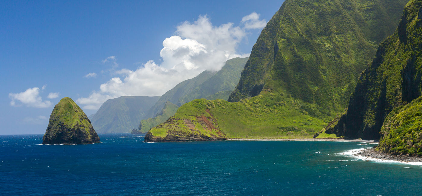 Image: The Molokai sea cliffs are a sight to behold. (photo via iStock / Getty Images Plus / Kridsada Kamsombat)