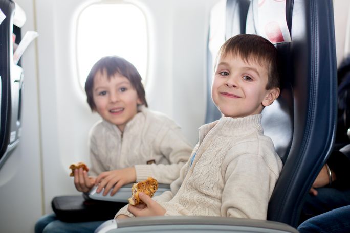 Kids eating on a plane, child, food, airplane
