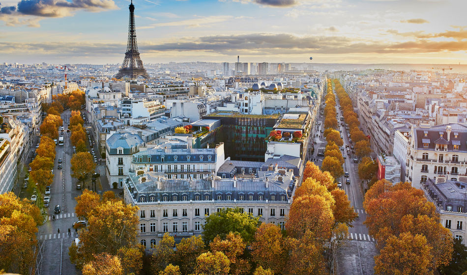 Aerial panoramic cityscape view of Paris, France with the Eiffel tower on a fall day (encrier / iStock / Getty Images Plus)