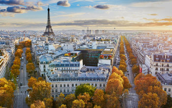 Aerial panoramic cityscape view of Paris, France with the Eiffel tower on a fall day (encrier / iStock / Getty Images Plus)