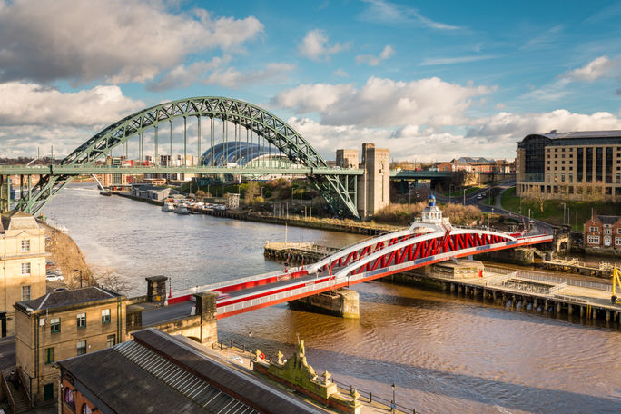 Iconic Tyne and Swing bridges over the River Tyne between Newcastle and Gateshead.