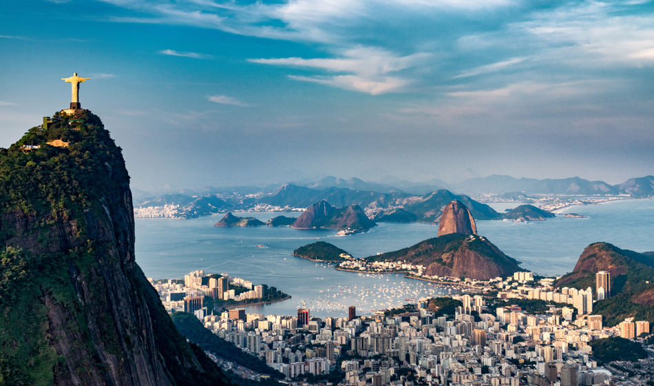 Aerial view of Rio De Janeiro. Corcovado mountain with statue of Christ the Redeemer, urban areas of Botafogo, Flamengo and Centro, Sugarloaf mountain. (photo via microgen / iStock / Getty Images Plus)