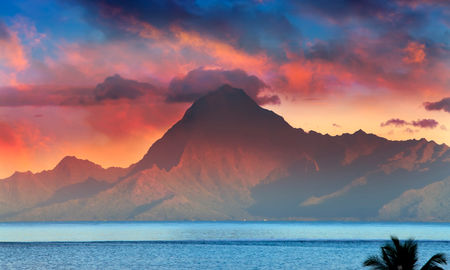 View on mountain Orohena at sunset. Polynesia. Tahiti. (photo via Konstik / iStock / Getty Images Plus)