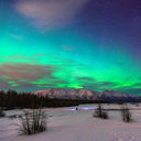 Beautiful green Northern light (Aurora Borealis) at Knik River in Alaska. (Photo via CNaene / iStock / Getty Images Plus)